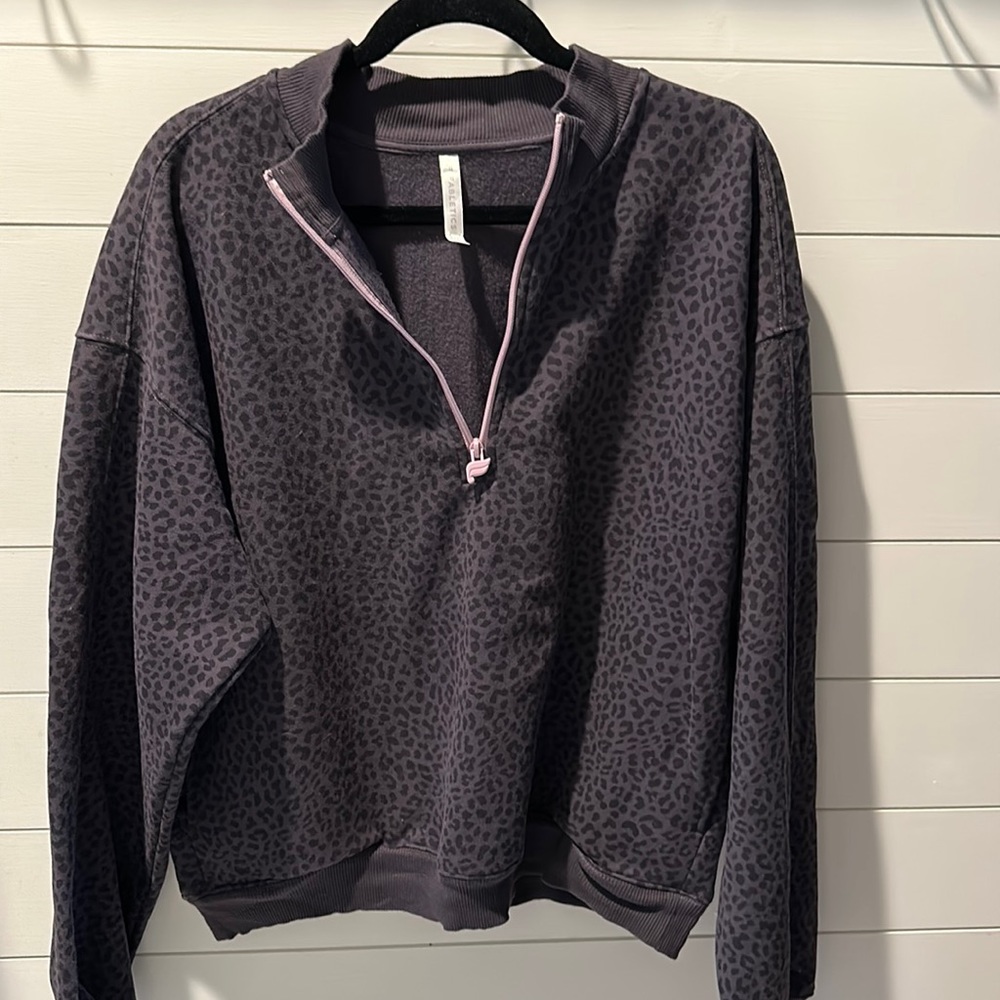 Fabletics XXL get/black cheetah print half zip sweatshirt with pink zipper.
